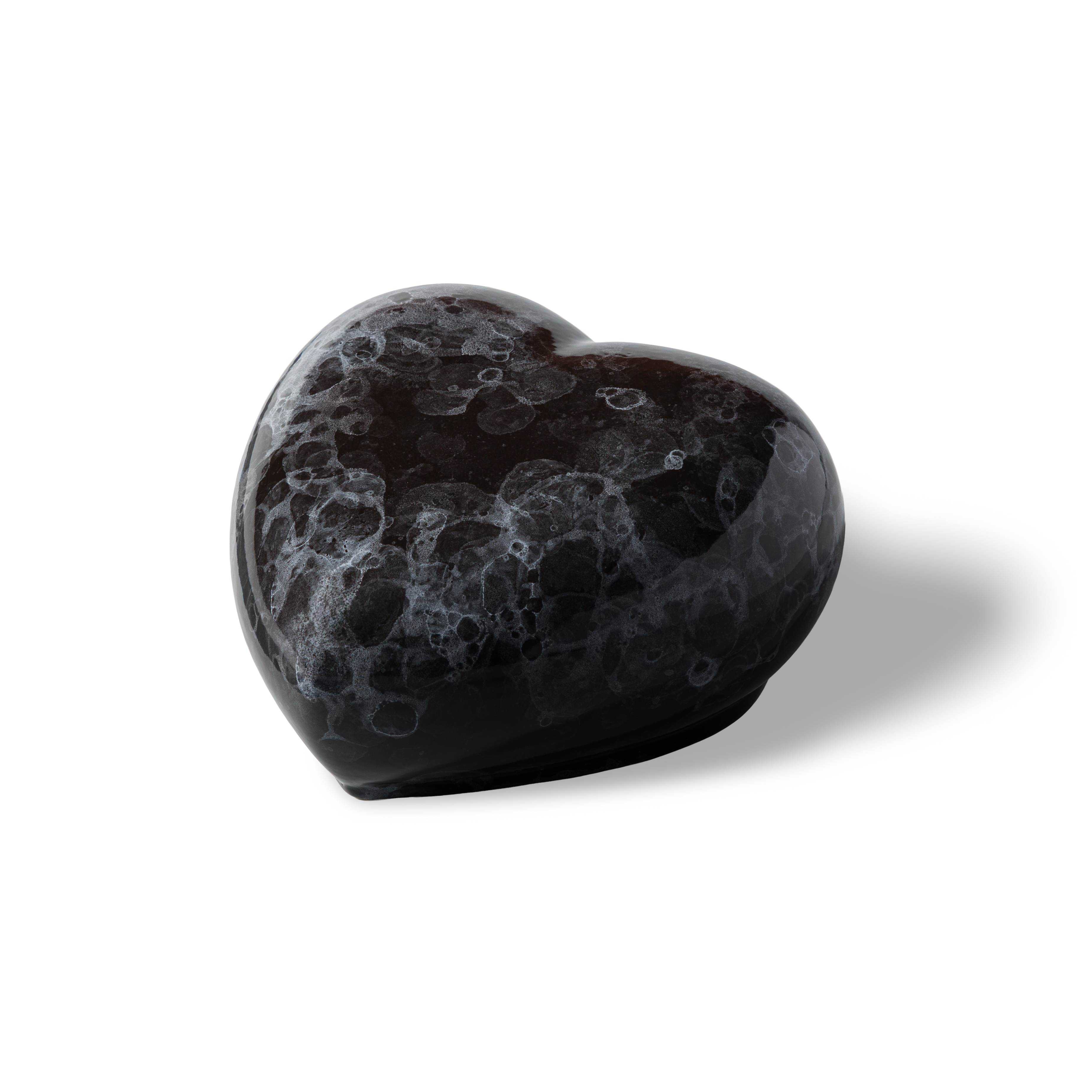 A generous heart-shaped ceramic pet urn in a black marble glaze, 850 ml.
